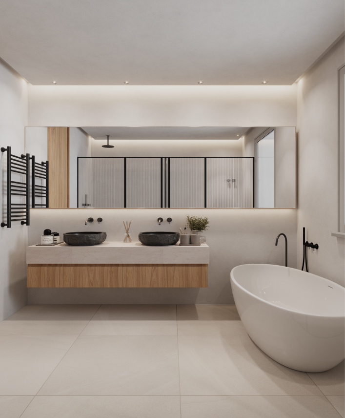 Baño principal con acabados de alta gama en vivienda reformada integralmente.